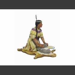 Woman mashing corn w/stone