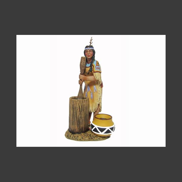 Woman mashing corn w/mallet