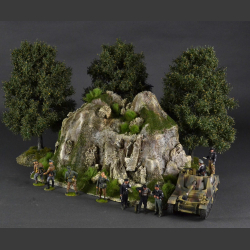 Rocky mountain with green grass peaks