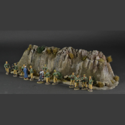 Rocky mountain with withered grass tops and green bushes