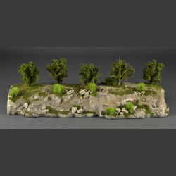 Cliff with green grass tops and green bushes