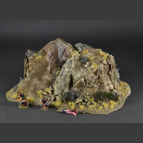 Double-sided rocky mountain with withered grass and desert bushes