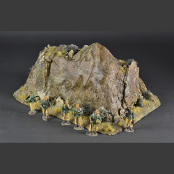 Double-sided rocky mountain with withered grass and desert bushes