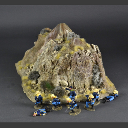 Double-sided rocky mountain with withered grass and desert bushes