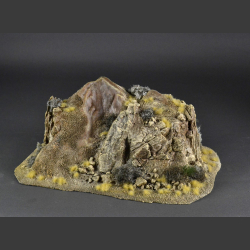 Double-sided rocky mountain with withered grass and desert bushes