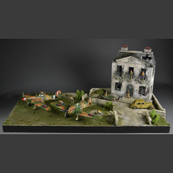 Manor house in shot and bombed condition with a large lawn - Diorama