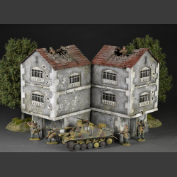 Two-story building with bullet holes and bombed roof