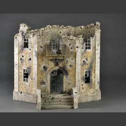 Facade of a bombed and shelled large Nazi building. 