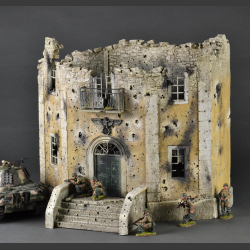 Facade of a bombed and shelled large Nazi building. 