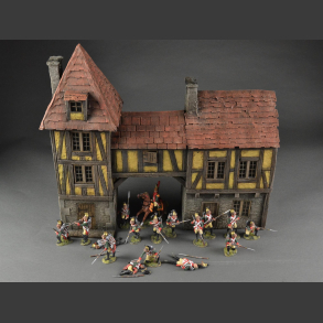Half-timbered house or medieval house with passage and tower building.