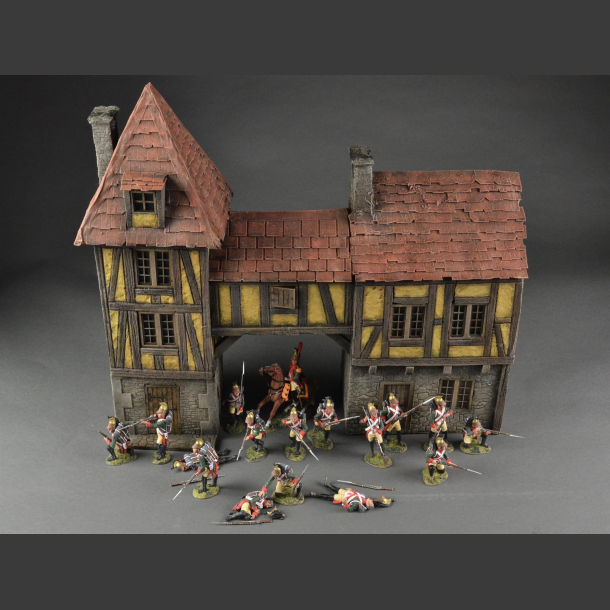 Half-timbered house or medieval house with passage and tower building.