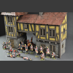 Half-timbered house or medieval house with passage and tower building.