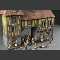 Half-timbered house or medieval house with passage and tower building.