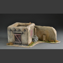 Desert house with wall
