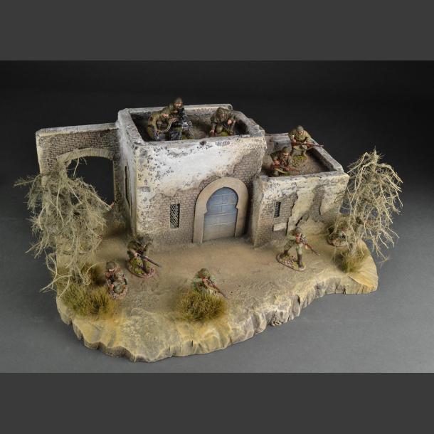 North African house with passage on rocky ground