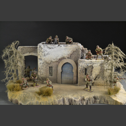 North African house with passage on rocky ground