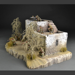 North African house with passage on rocky ground
