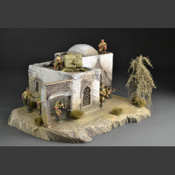 North African Mosque with passage on rocky ground
