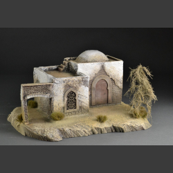 North African Mosque with passage on rocky ground