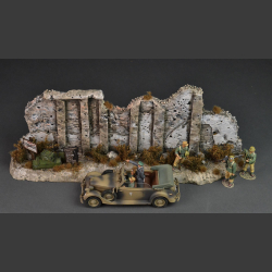 Tobruk - North African stone wall with dry bushes and grass