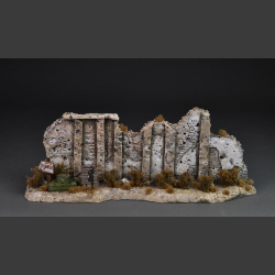 Tobruk - North African stone wall with dry bushes and grass