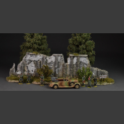 Normandy - stone wall with green bushes and grass