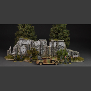 Normandy - stone wall with green bushes and grass