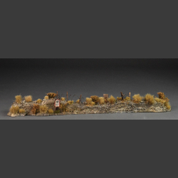 Rampart with dry vegetation, minefield and barbed wire