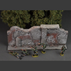 Bombed and shot brick wall